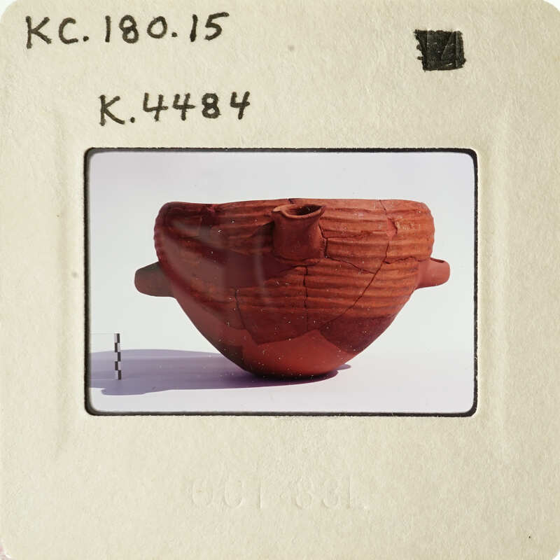 Ancient ceramic bowl with intricate designs on display.