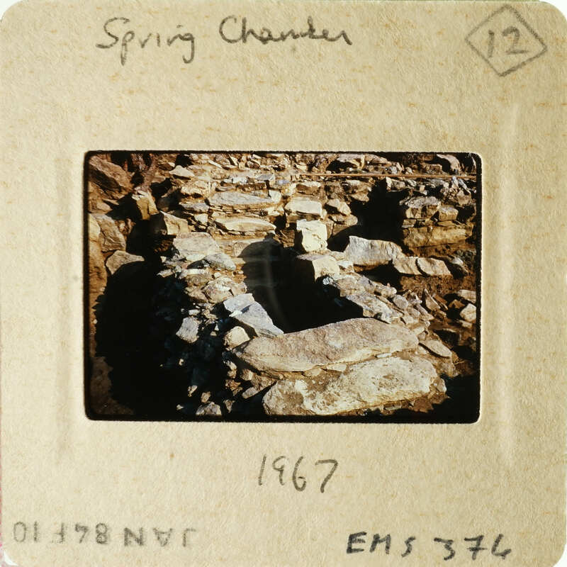 Old photograph of ruins with visible film marks and date stamp.