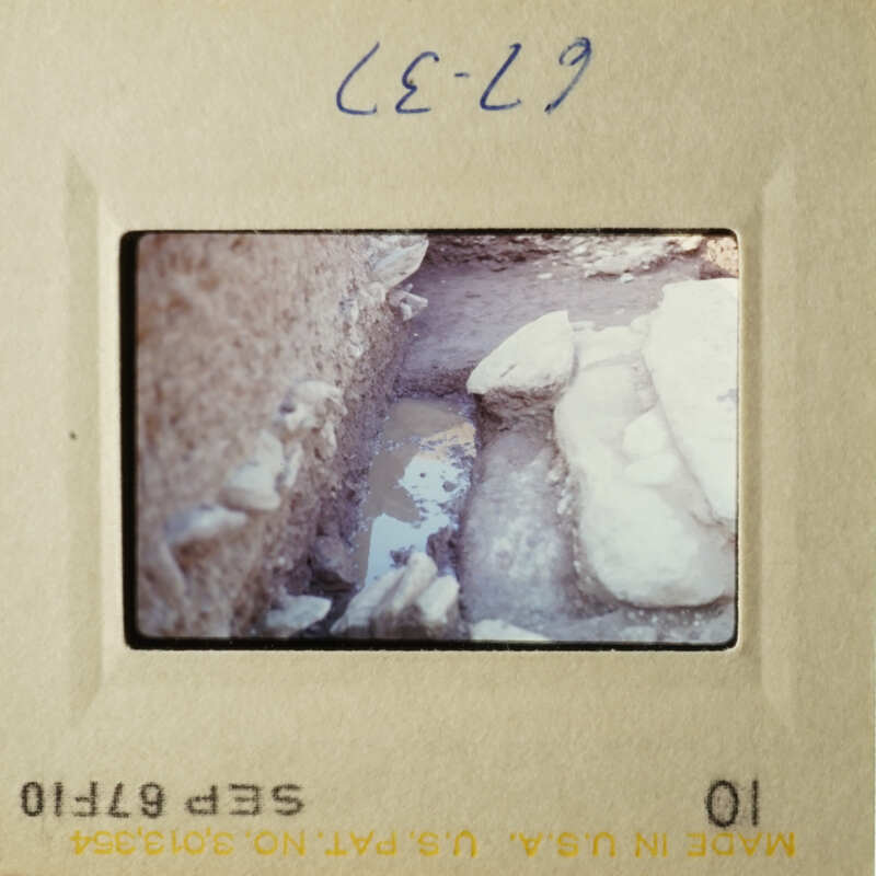 Two photos showing archaeological excavation site with stone ruins and dirt ground.