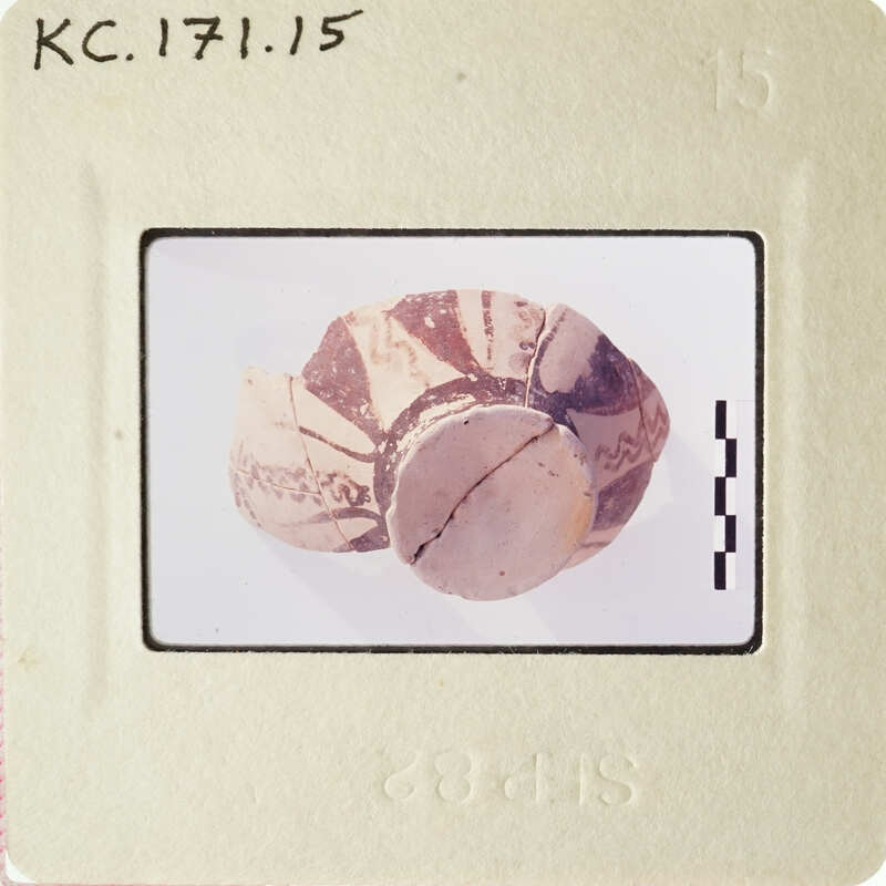 Ancient pottery with patterns on display.