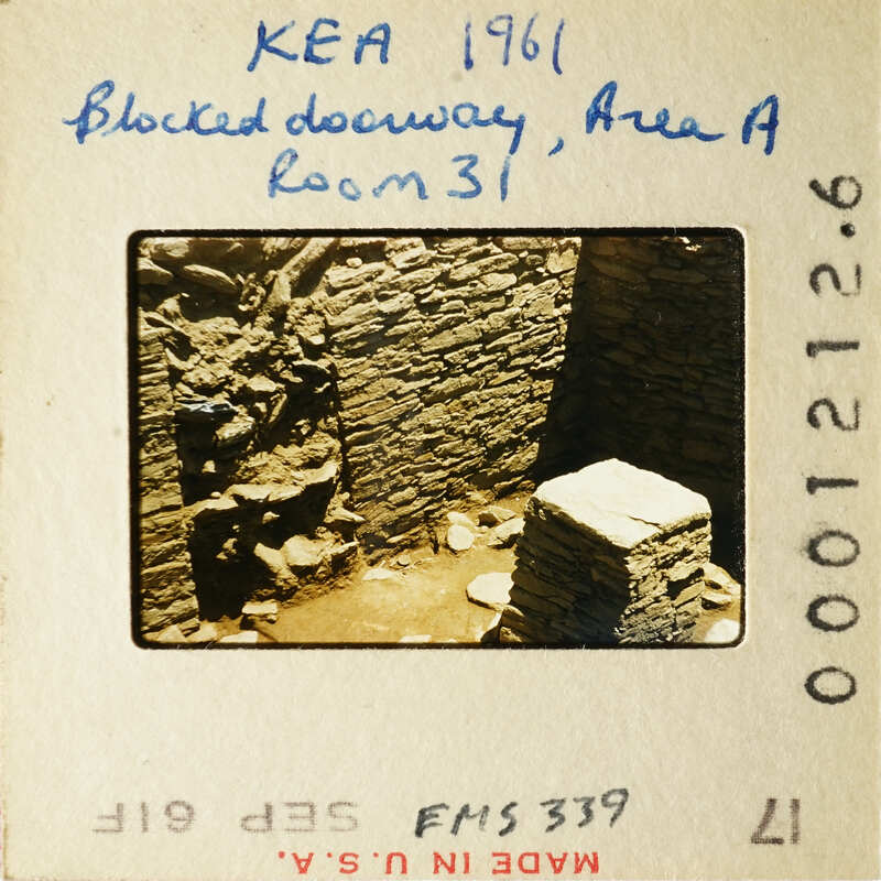 Old photograph of an archaeological site with stone ruins, possibly from ancient times.