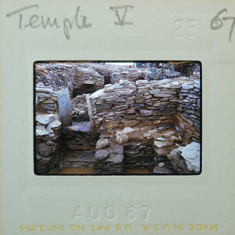 Stone building with doorway, floor surface underwater