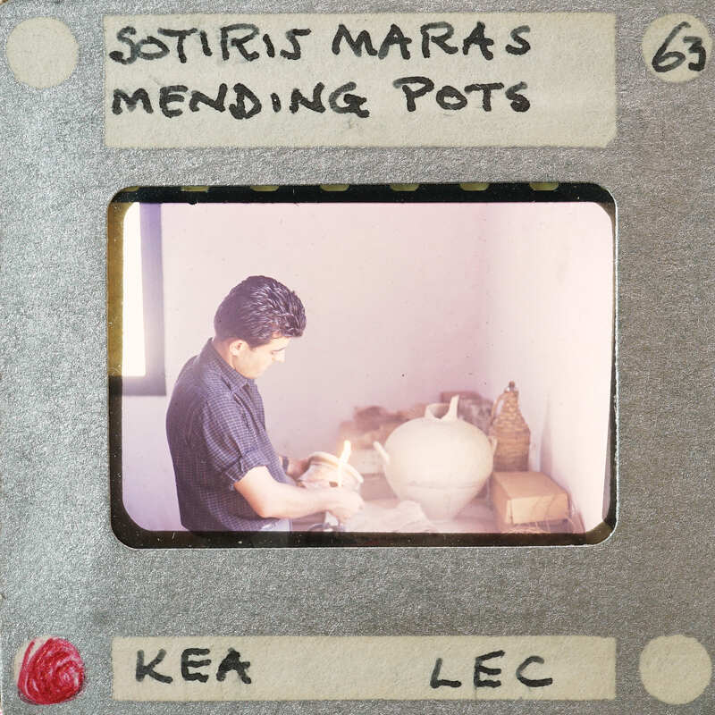 A man working on a pottery wheel, captured in an old photograph with film strip borders.