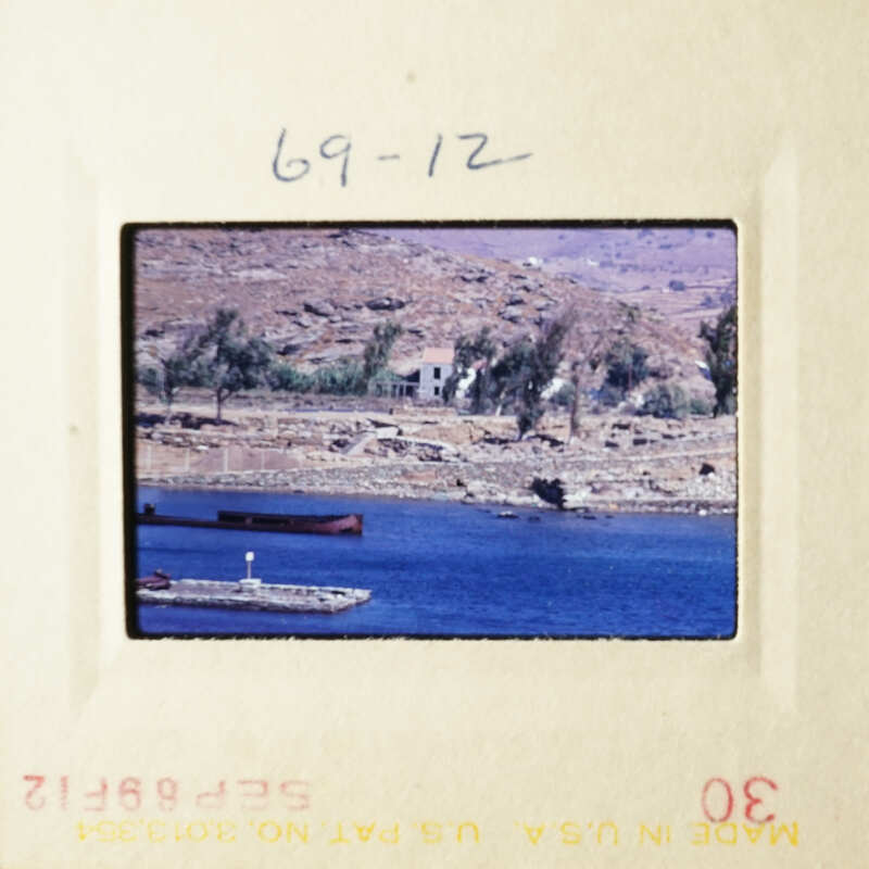 Two photos depicting scenic views, with one showing a body of water and the other featuring a landscape with houses and boats.