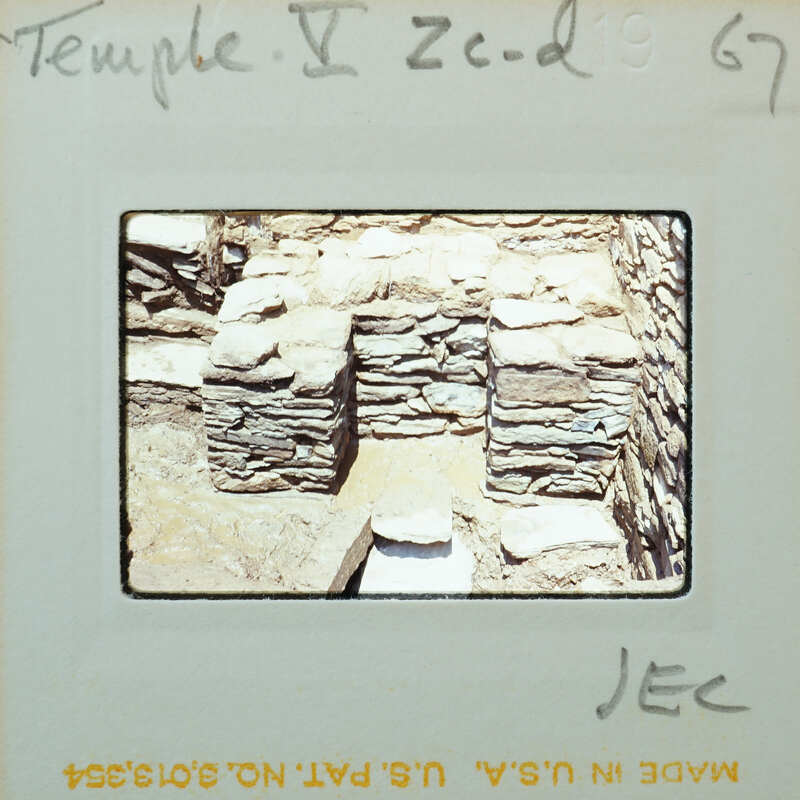 Stone walls and muddy floor.