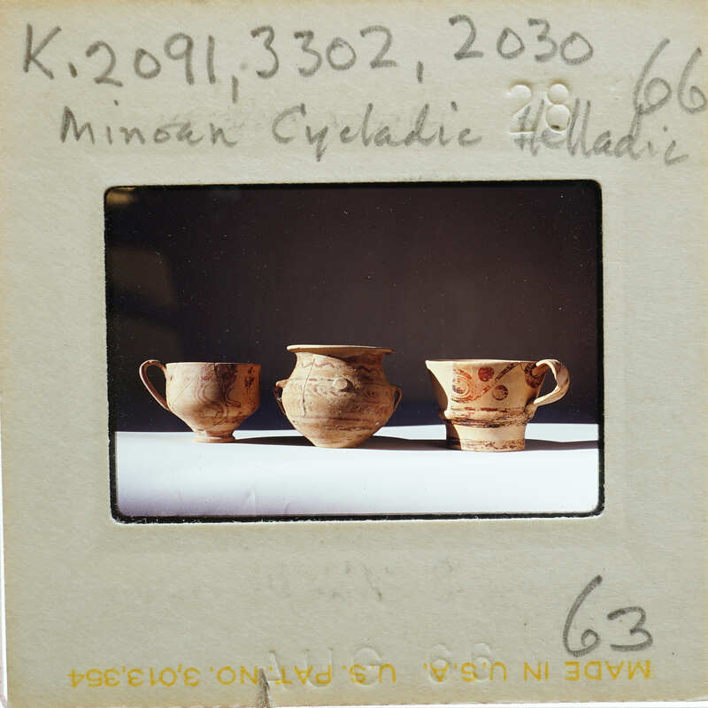 Three pots (K.2091, K.3302, K.2030) in profile on table.