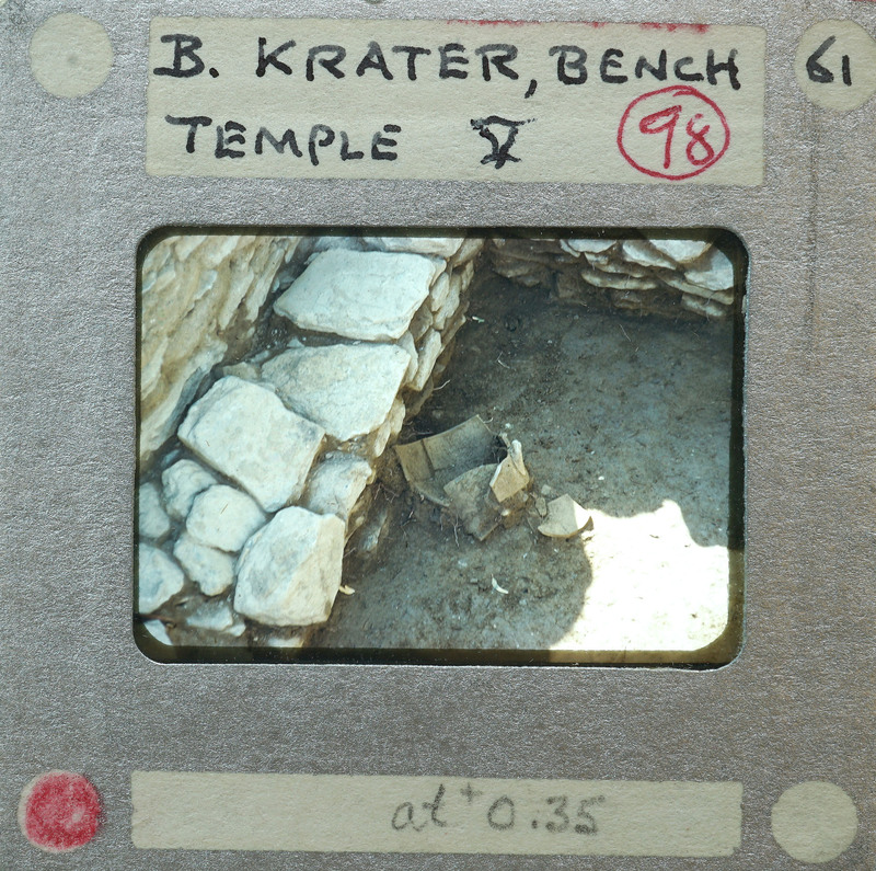 An old photograph of a stone structure with annotations on the border, possibly from an archaeological site.