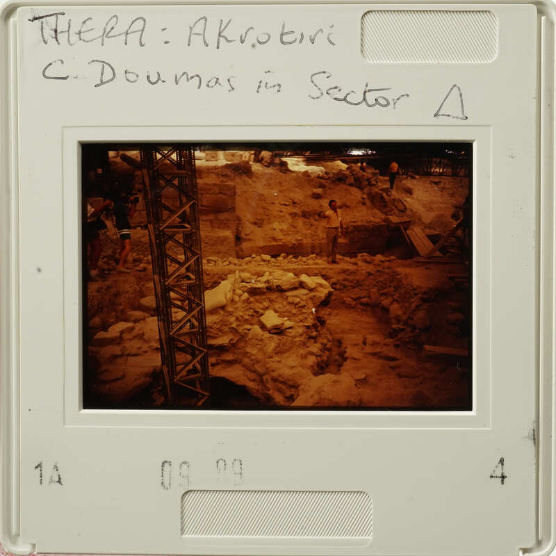 Archaeological site with ruins and scaffolding, as seen on an old slide.
