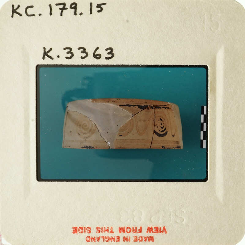 Ancient artifact with carvings on display.