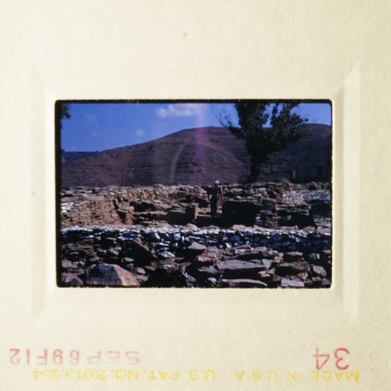 A photograph capturing a rocky landscape and a clear blue sky.