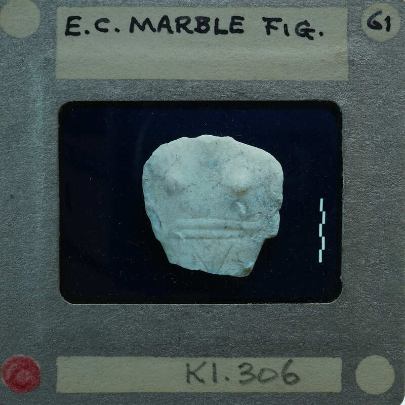 Marble figurine torso fragment.