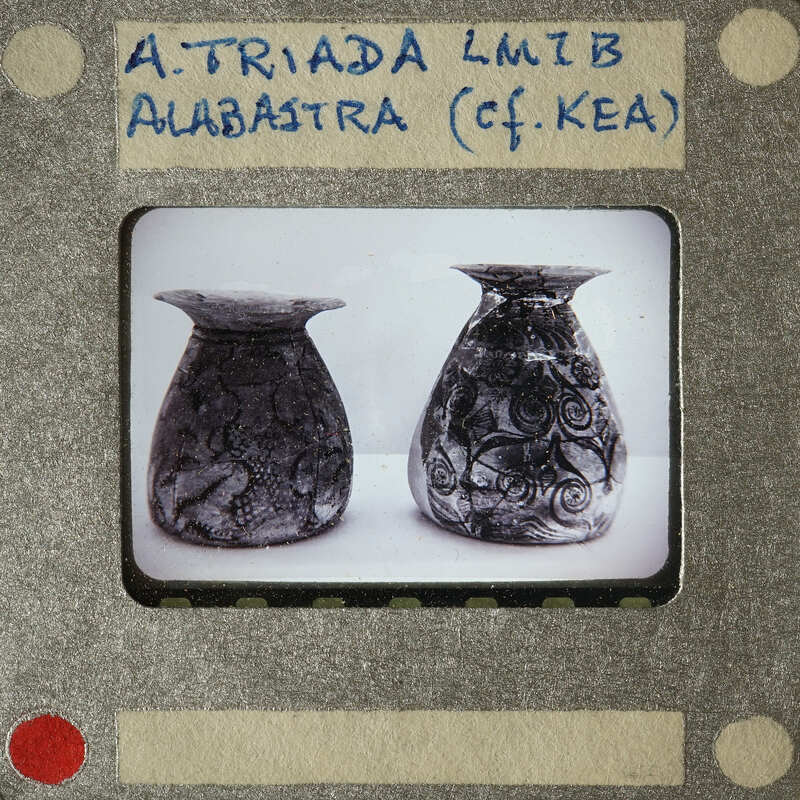 Two decorative vases with intricate designs, possibly from an archaeological site.