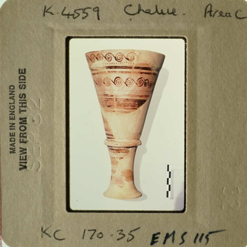 A photograph of an ancient Greek amphora with decorative patterns.