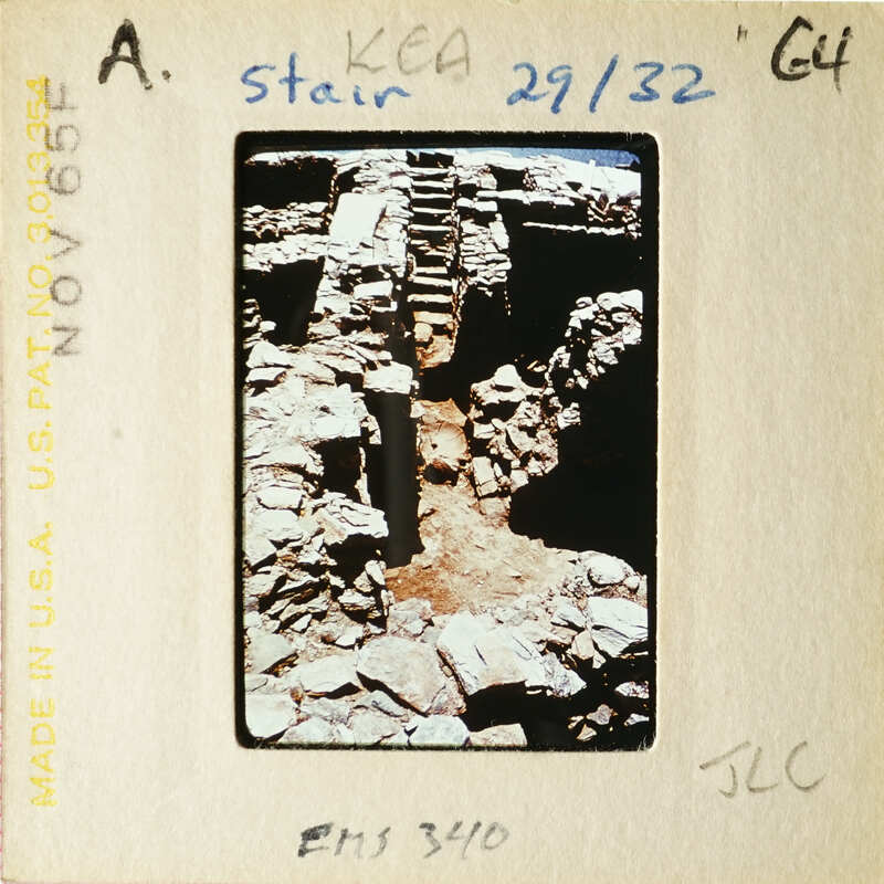 Ancient ruins with stone steps and walls, possibly from an archaeological site.