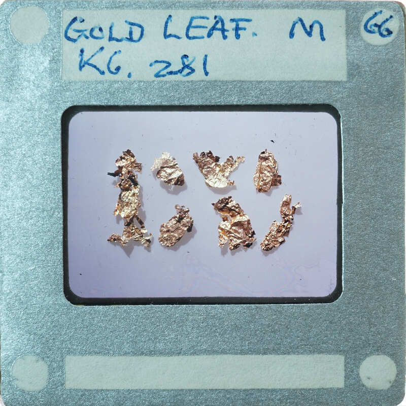 Gold leaf samples on a card with labels and numbers.