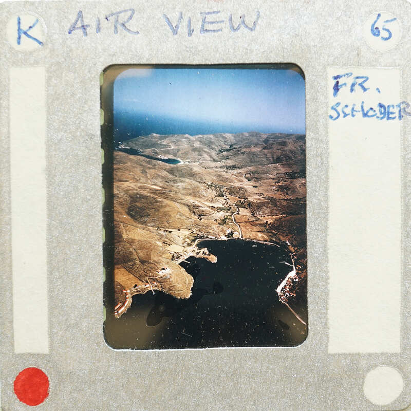 Landscape with mountains and a body of water.