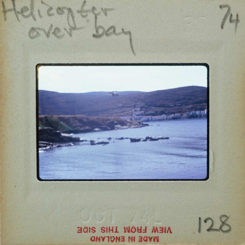 A body of water with mountains in the background.