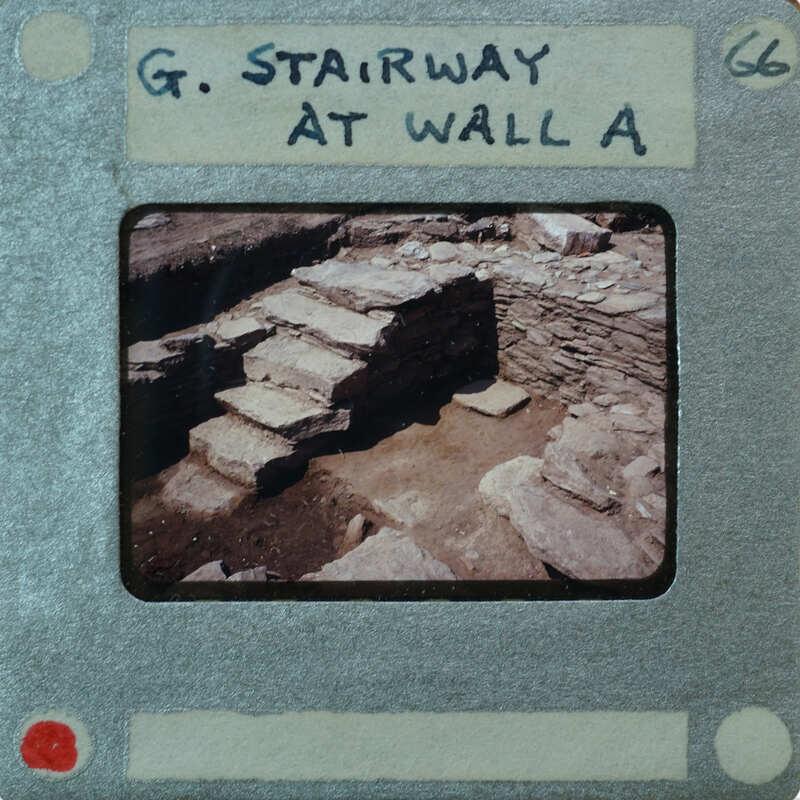 Old photo of a stone staircase with handwritten label on the border.