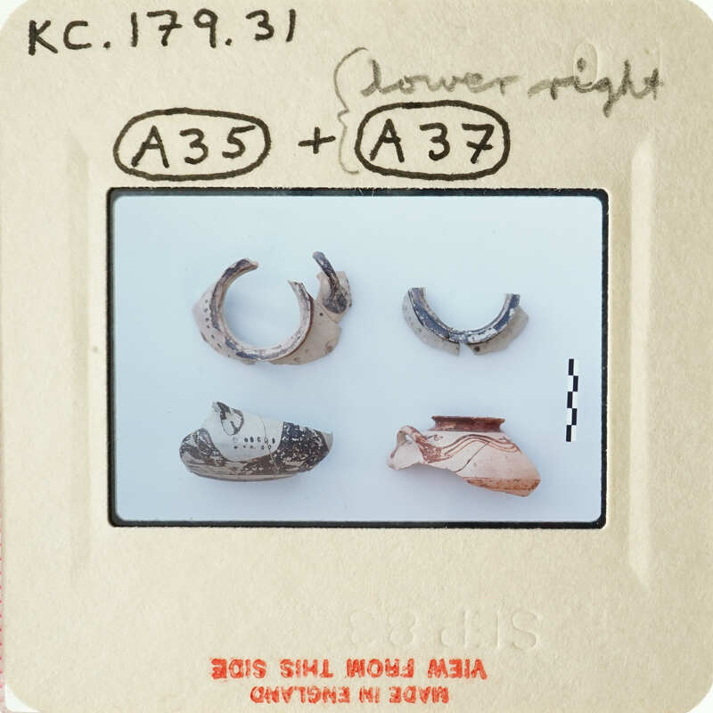 A collection of ancient jewelry, including rings and bracelets, displayed on a white background.