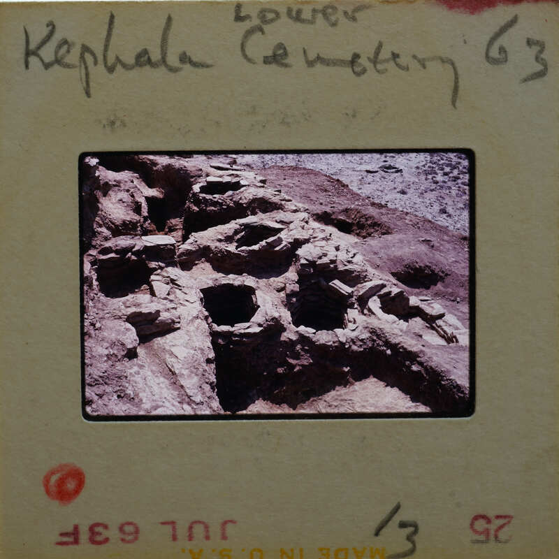 Ancient ruins with holes and a stone structure.