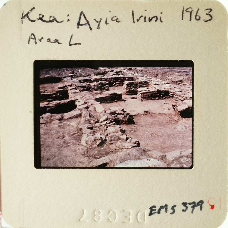 Ancient ruins with stone columns and walls, photographed on film.