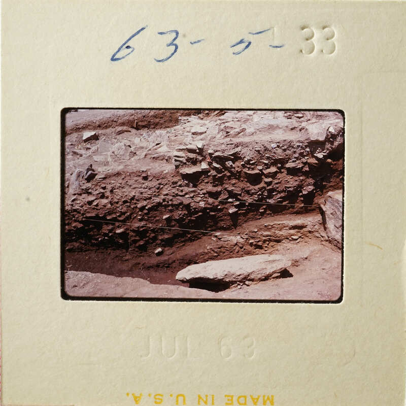 A photograph of an outdoor scene with rocks and dirt, taken on July 6, 1963.