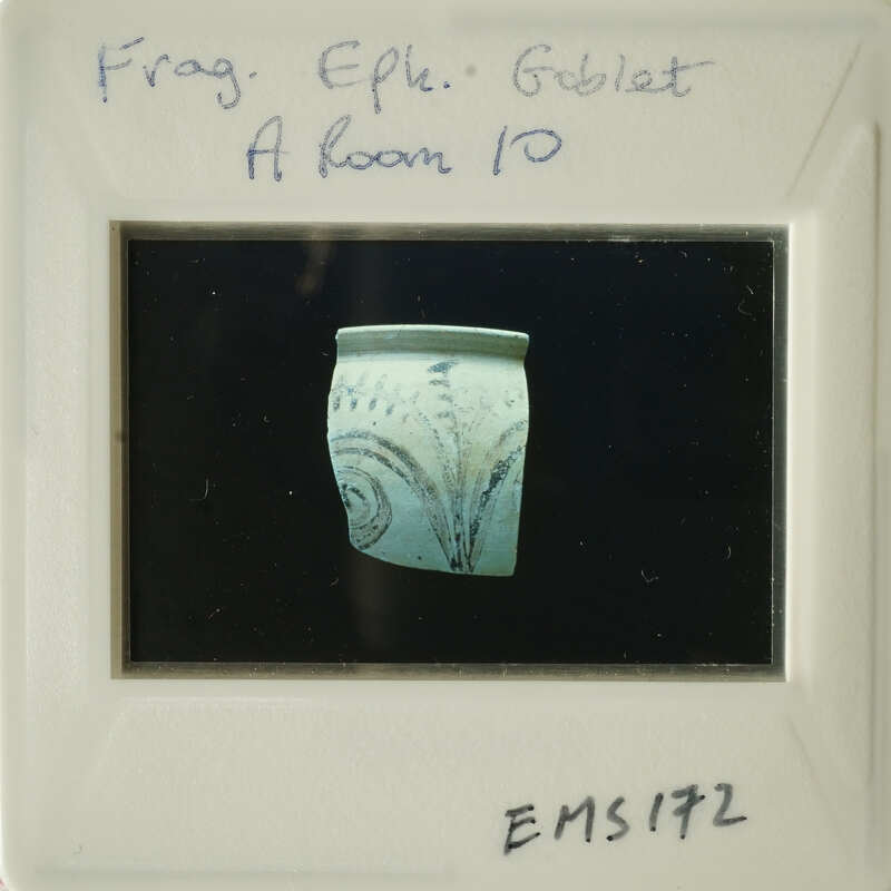 Ancient Greek vase with intricate designs on display.