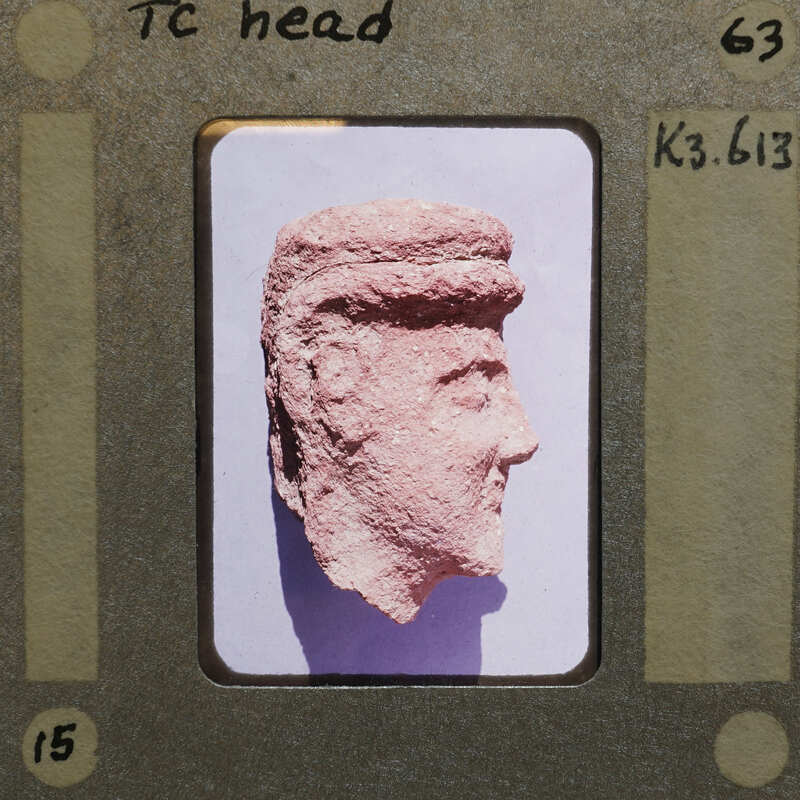 Left side of terracotta head (K3.613) in profile.