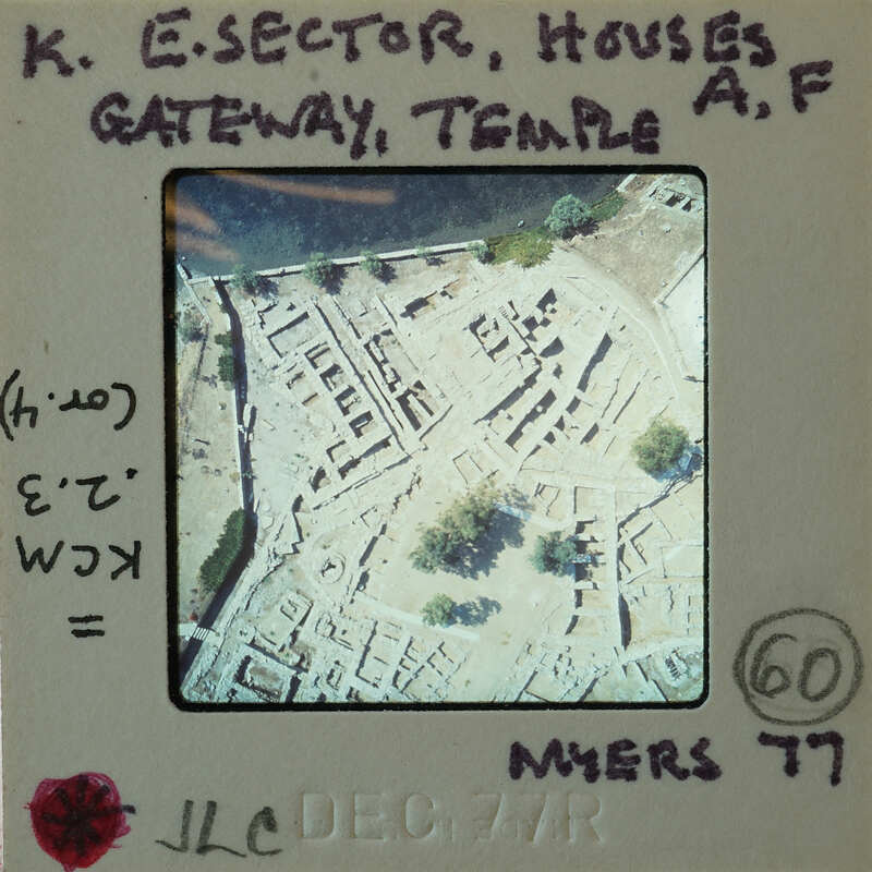An aerial photograph of an archaeological site with annotations and numbers, possibly indicating features or measurements.