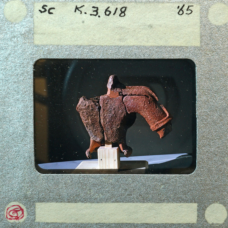 Partially reassembled terracotta showing back of torso and right arm K3.618.