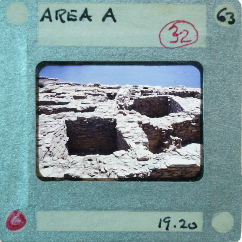 A photograph of an ancient stone structure with a label on it.