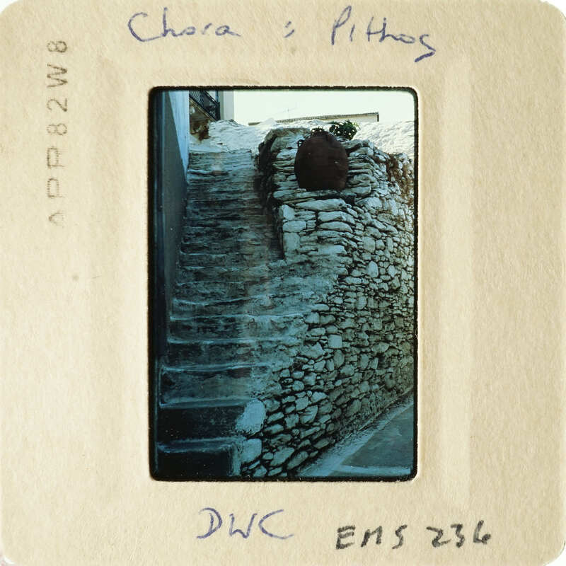 A photograph of stone steps with a rustic wall, taken from an elevated perspective.