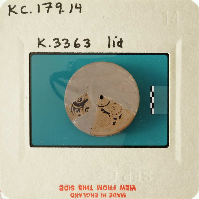 Ancient coin with intricate designs and markings.