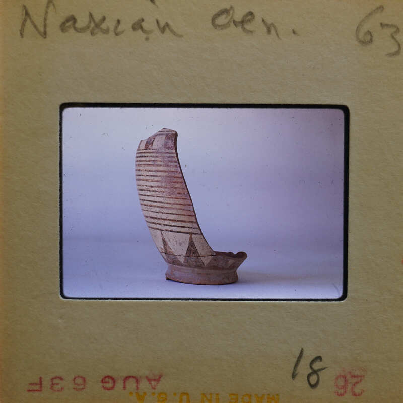 Pottery profile fragment showing line and triangle patterm.