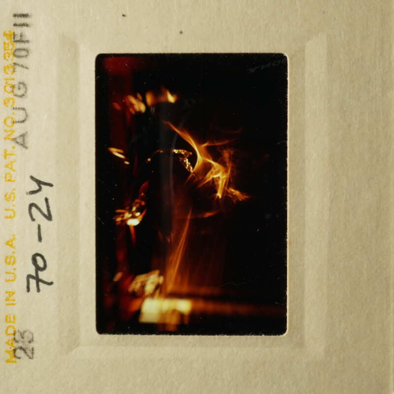 This is an image of a fire on a piece of paper with a yellow border.