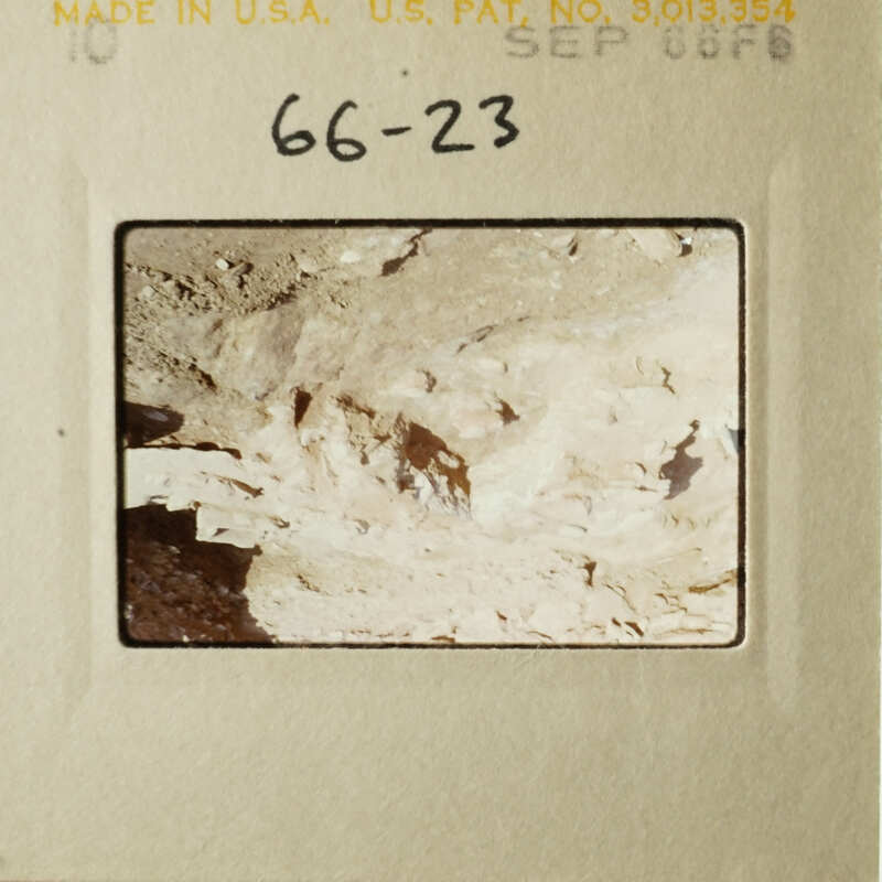 A vintage photograph of a rocky landscape with a barren, rugged terrain.