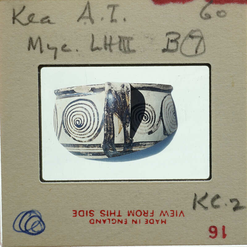 A photograph of a decorative clay pot with swirling patterns.