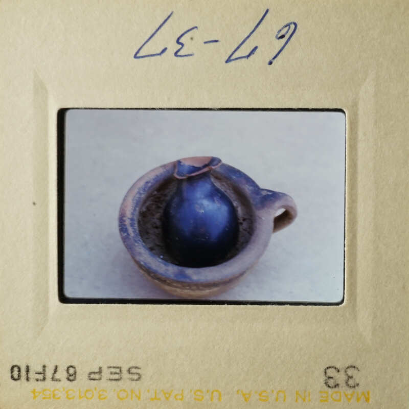 A small blue pottery piece on display.