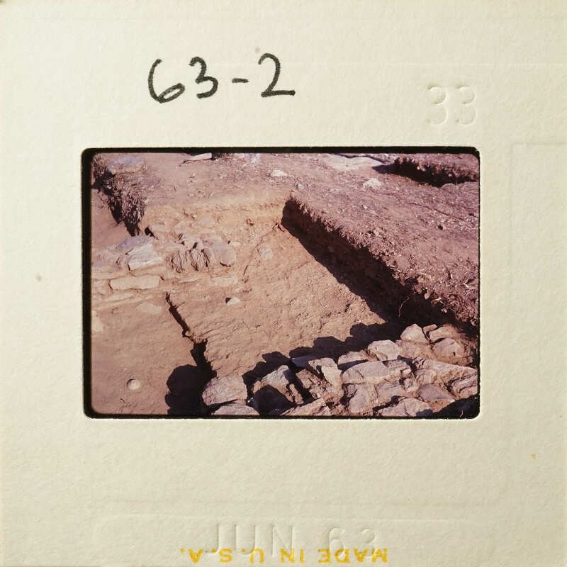 Old ruins with exposed layers of stone and dirt.