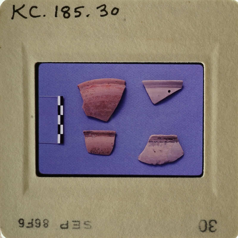 Old pottery shards on blue background.