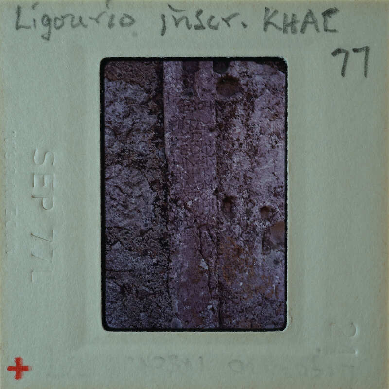 A photograph of a stone wall with visible mortar, placed on an old-fashioned film strip.