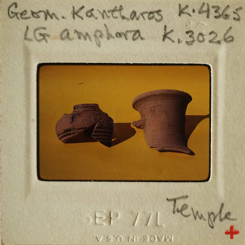 Two ancient clay pots on display.