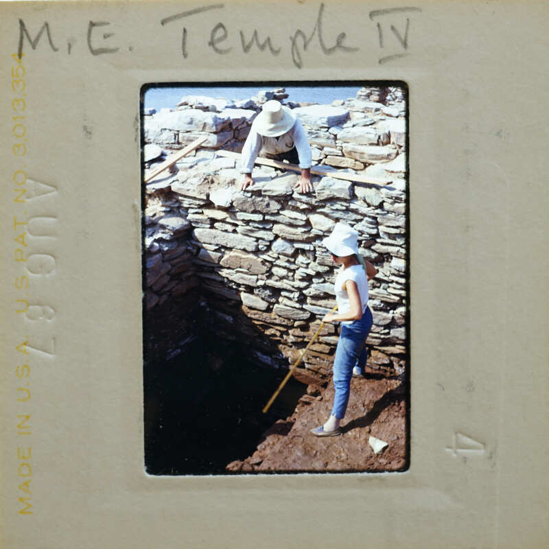A slide of a people working on a stone structure, with the image marked as "M. E. Temple 17".