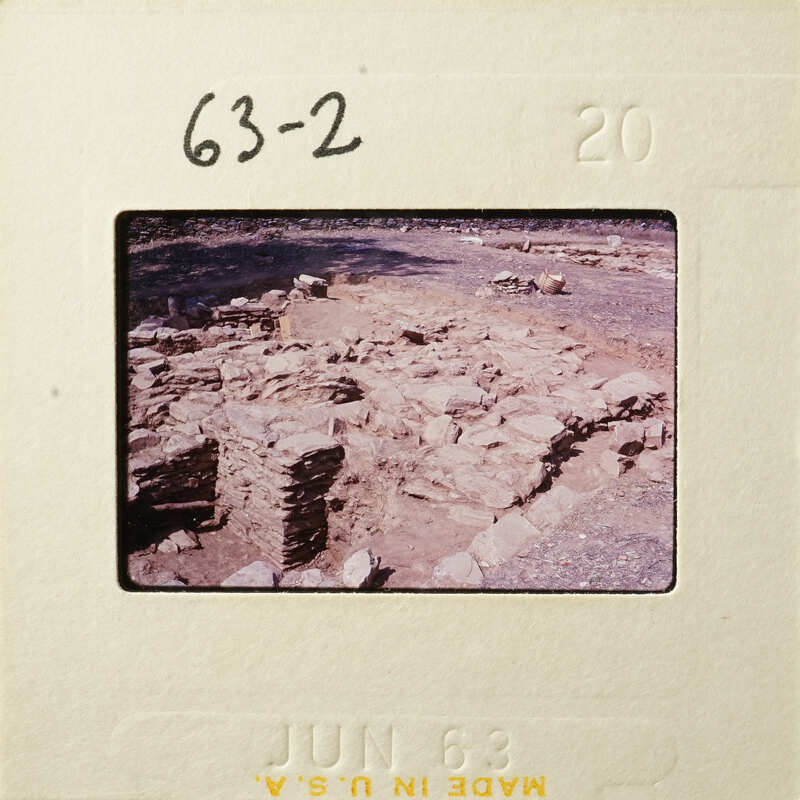 Old photograph of an archaeological site with ruins and rocks, dated June 1968.