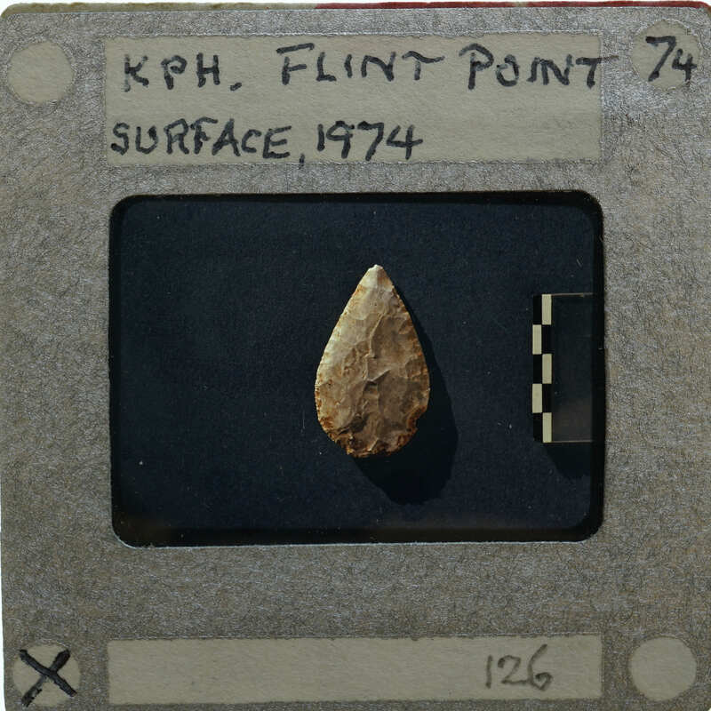 A photograph of a flint point artifact.