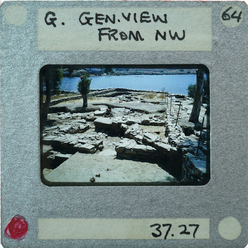 A photograph of a historical site with ruins and water, taken from a vintage Polaroid camera.