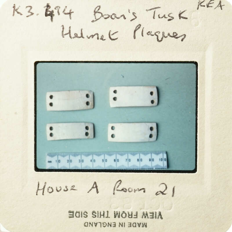 A collection of small, rectangular objects with circular cutouts on a blue background.