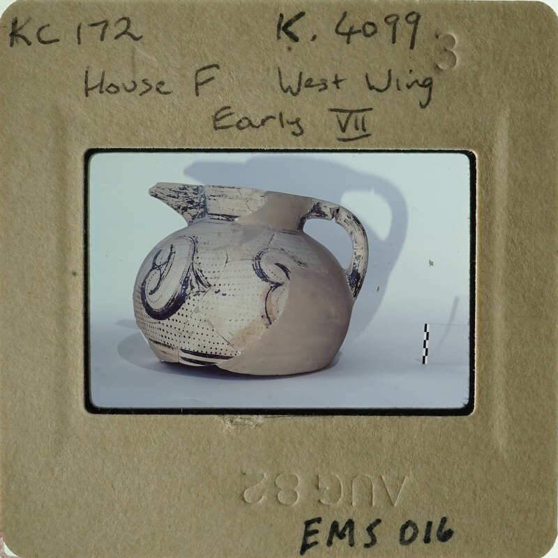 Ancient pottery with unique markings on display.