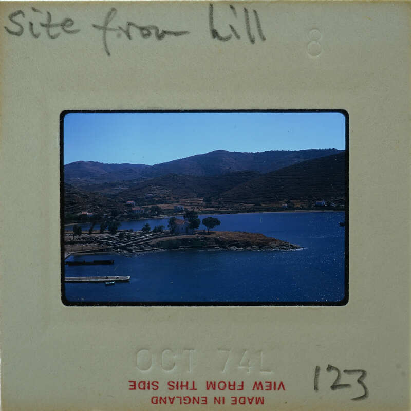 Picture of a lake with mountains and trees, on an old film strip.