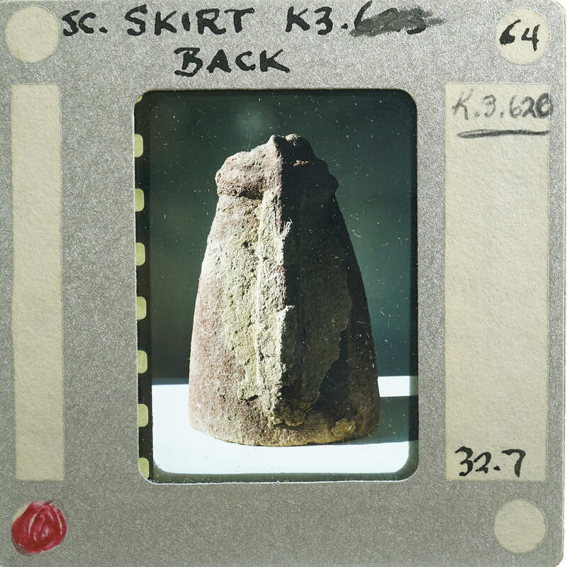 Terracotta figurine detail showing skirt from the back.